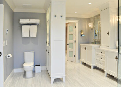 Modern small bathroom remodel with space-saving floating vanity, glass shower doors, and smart storage solutions.